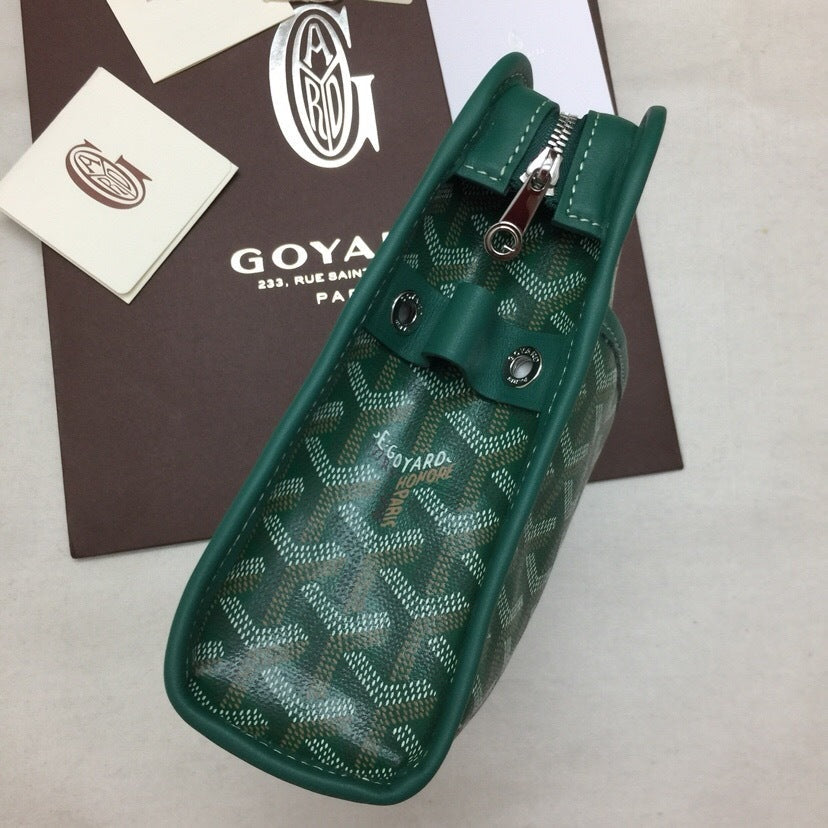 Inside open view of green Goyardine canvas travel toiletry bag