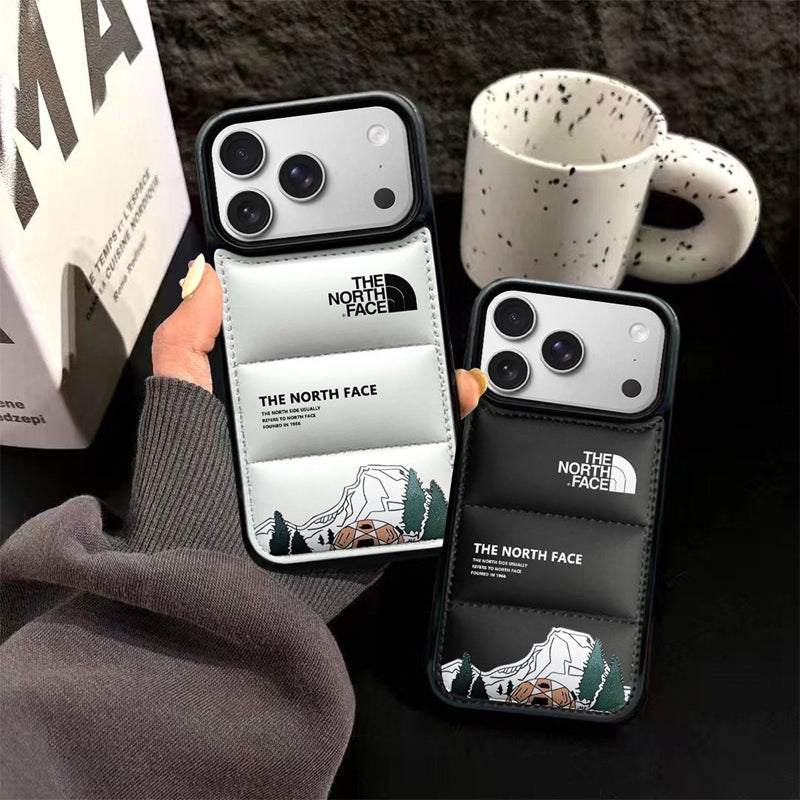 Luxury streetwear puffer jacket style phone covers in black and white for modern iPhones