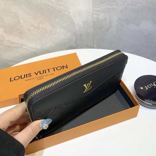 Louis Vuitton Wallet Made of Leather Embossed with the Brand's Logo