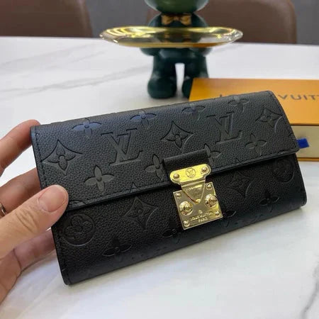 Louis Vuitton Slender Wallet – Monogram Seal Embossed Cowhide