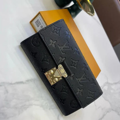 Louis Vuitton Slender Wallet – Monogram Seal Embossed Cowhide