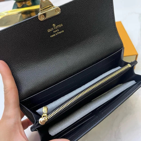 Louis Vuitton Slender Wallet – Monogram Seal Embossed Cowhide