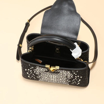 Louis Vuitton Bag is Made of Genuine Leather and Decorated with Diamonds