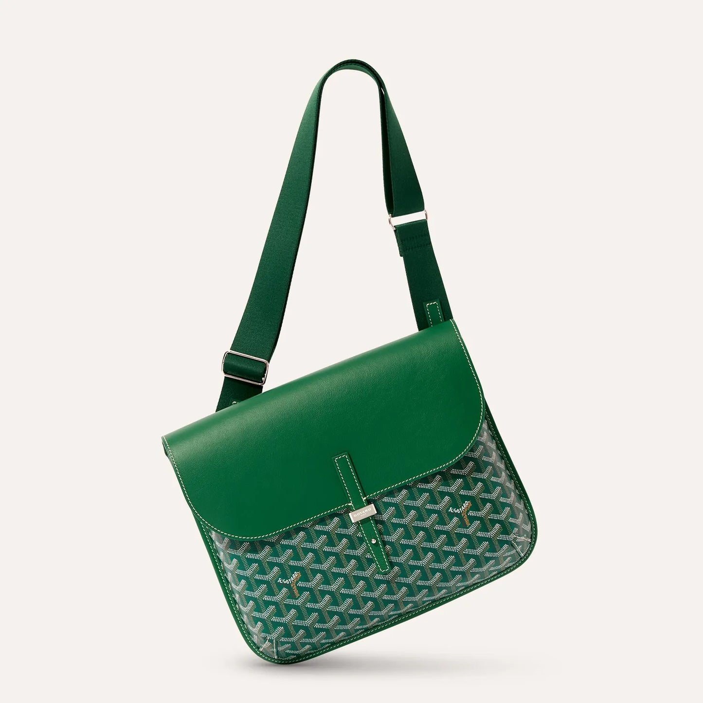 Side angle view of luxury Goyardine canvas messenger bag in green