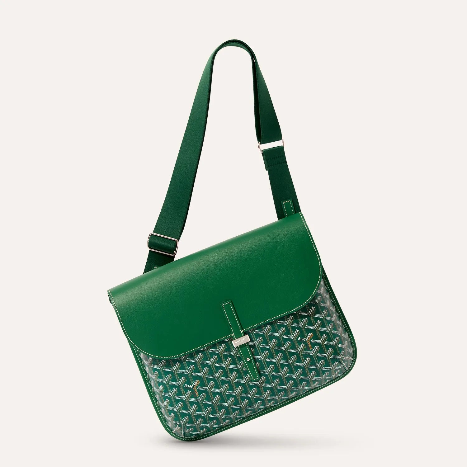 Side angle view of luxury Goyardine canvas messenger bag in green